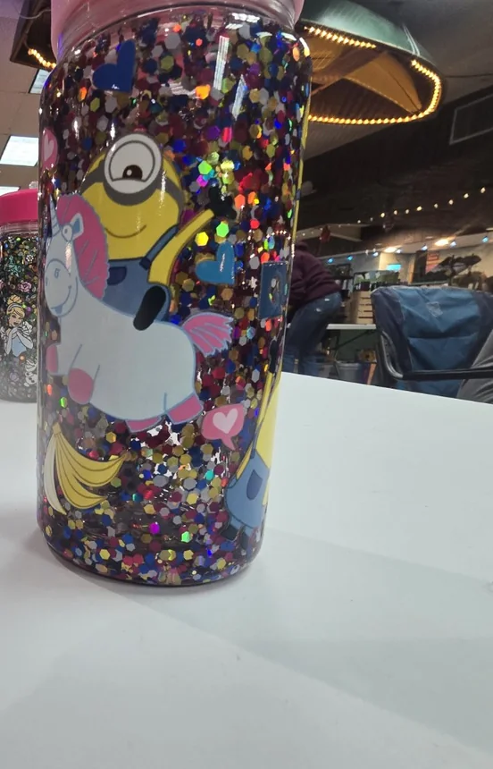Colorful glitter kids tumbler with a cartoon-style design