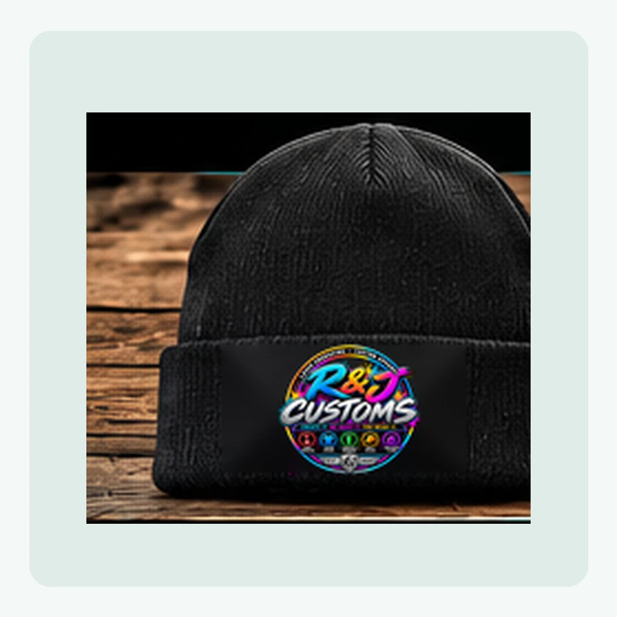 Mockup of black ribbed knit beanie with the official neon R and J Customs logo